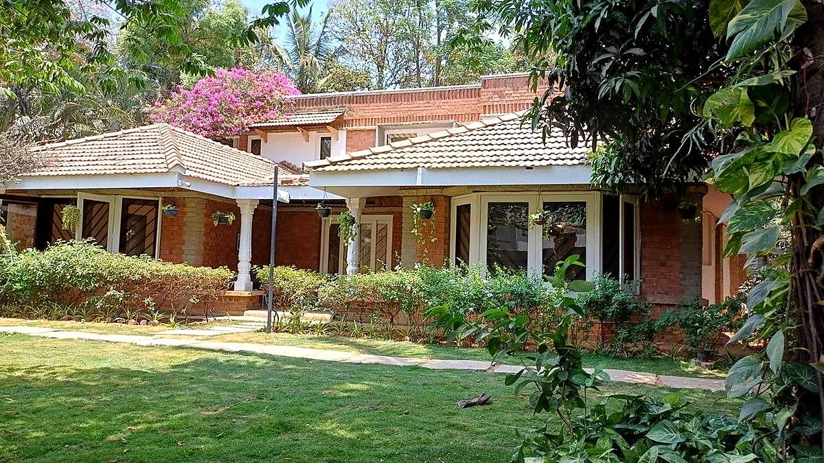 Namma Ashram’s brick building and garden frontage in Whitefield