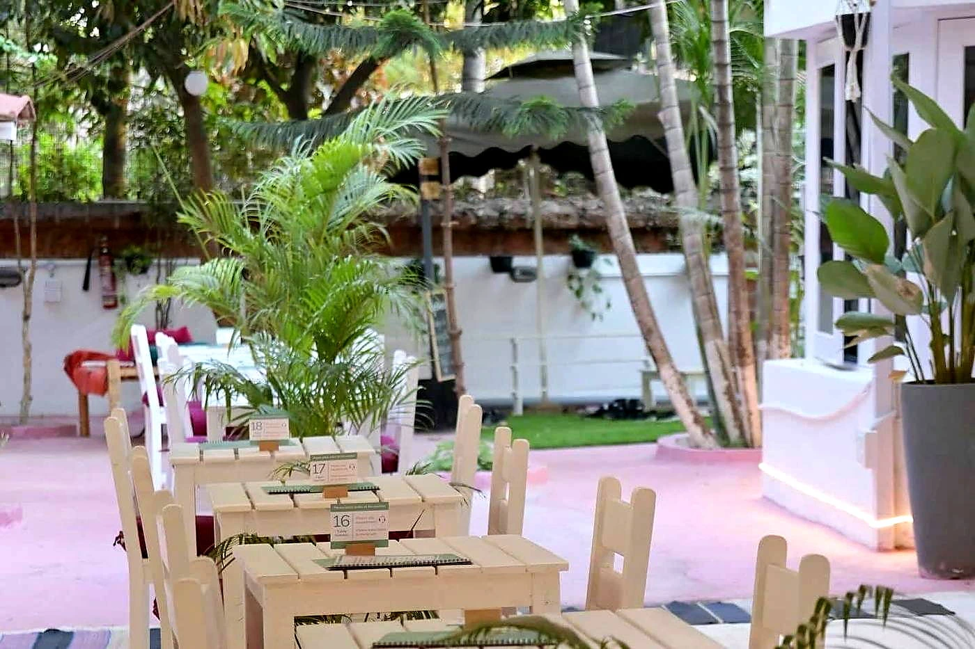 Garden café tables at Namma Ashram in Whitefield