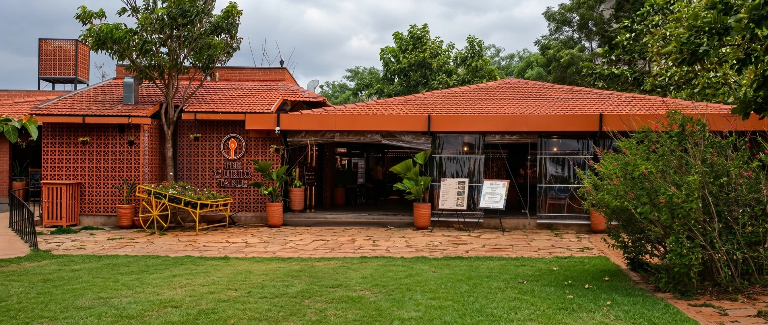 The Curio Table’s tiled-roof frontage, terracotta lattice and garden entrance